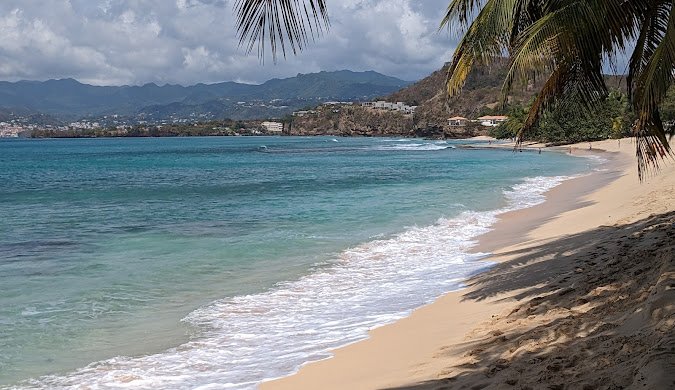 🌴 Overview Location: Southeastern Caribbean, part of the Lesser Antilles. Main islands: Grenada, Carriacou, and Petite Martinique. Capital: St. George’s. Population: ~125,000 people. Language: English (with a Grenadian Creole spoken informally). Currency: Eastern Caribbean Dollar (XCD).